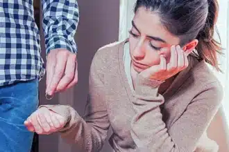Man giving his wedding ring back to his sad wife. Who Files First in an Illinois Divorce