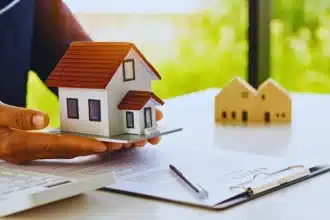 A real estate agent offers a sample home insurance home to sign the agreement. Forced to Sell Your House in an Illinois Divorce